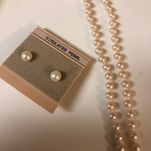 Simulated ivory pearl necklace and earring set.